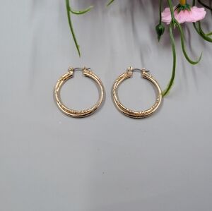 Vintage Y2K Era Gold Plated Twisted Hoop Earrings